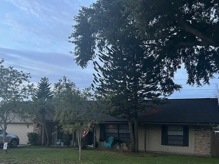 New roof: front porch: (2) car garage:mature landscaping: fenced lot with gate for secure boat parking:Lake Community
