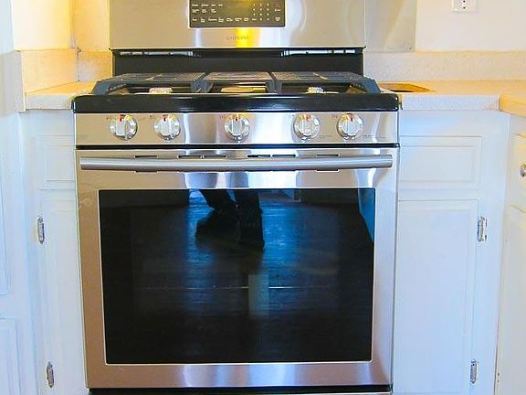 New Stainless Steel Stove and Range Hood