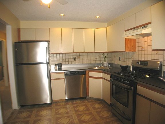 Stainless Appliances in a Spacious Kitchen