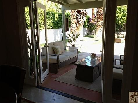French doors from formal dining room to out door living area