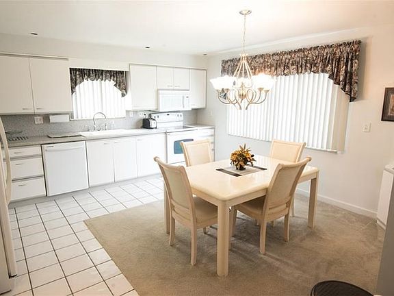 update kitchen with newer appliances, neutral counters, and backsplash.