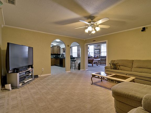 Family Room has arch ways going into kitchen and game room