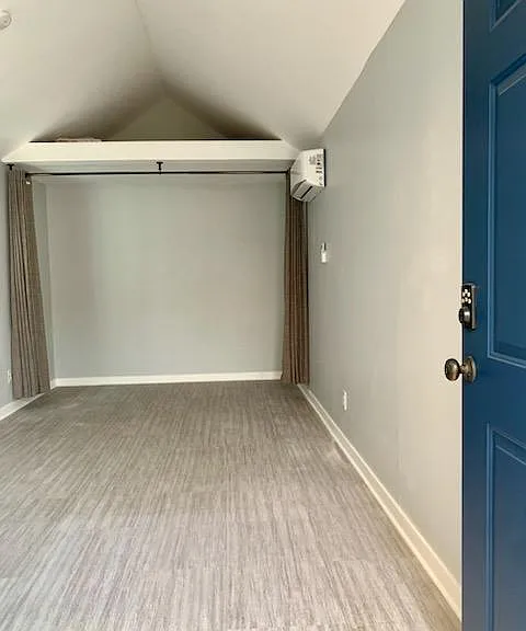 Interior view, has "attic space" and curtained off area in the back for storage if that's what you want to use it for.