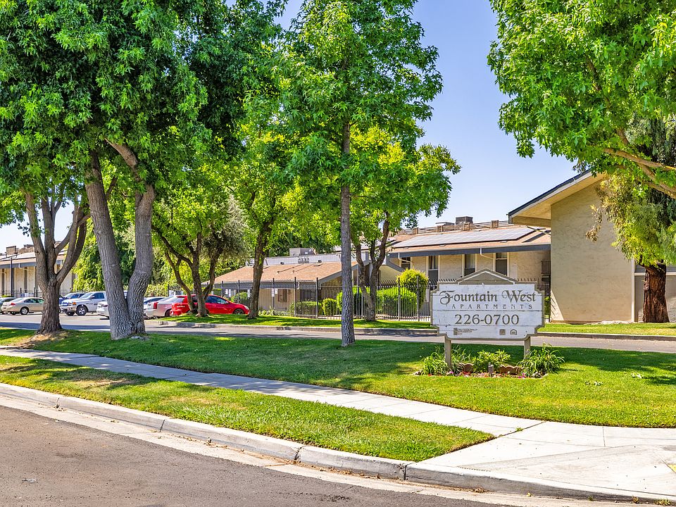 Affordable housing community with lush landscaping and a warm welcome.