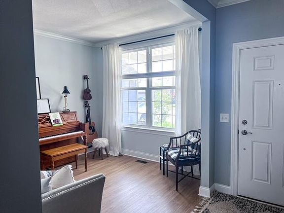 Generous flex space just inside the front entrance. Office, living room, music room- so many options