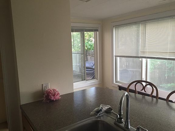 kitchen showing private fenced yard.