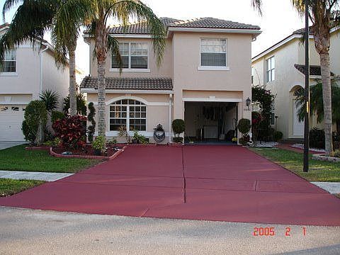 Front of house with double wide driveway