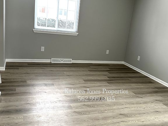 Good sized living room with fresh paint and flooring
