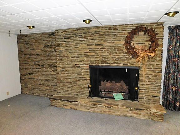 Cozy up on cold winter nights by this large brick fireplace.