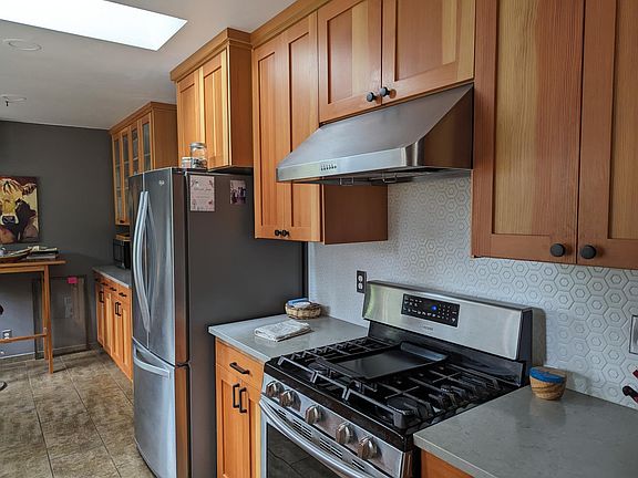 Stainless steel appliances and gorgeous custom cabinetry