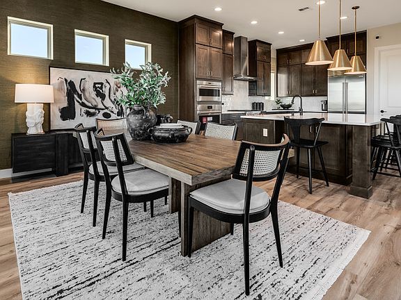 Quaint cafe off the kitchen is perfect for enjoying quick meals as a family.