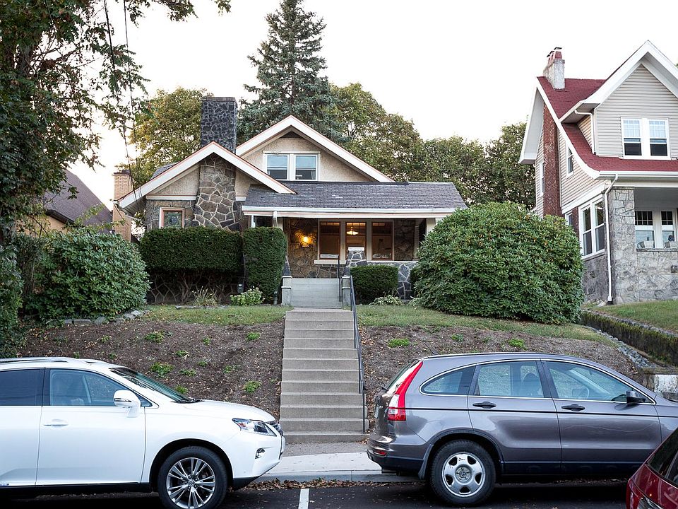 Craftsman bungalow originally built in the 1920s combines stone, wood, and stucco with a slate roof - one block off Potomac and two and a half block walk to the trolley