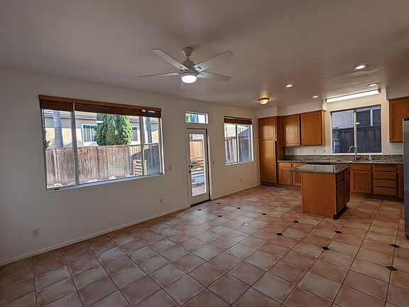 Kitchen from Family/Hearth Room with access to the quiet and spacious backyard. Canned lighting.
