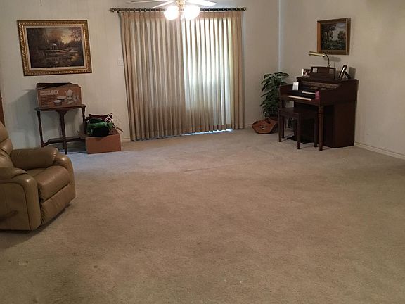 Other side of den with sliding glass door to back porch. (Furniture not included)