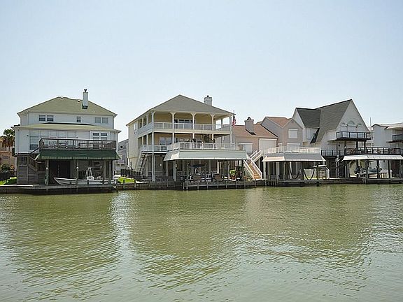 Gorgeous custom home on wide part of canal.