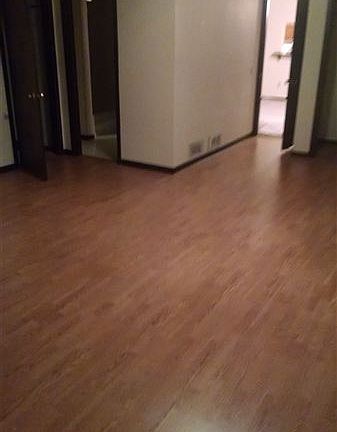 master bedroom with Pergo flooring 16x20