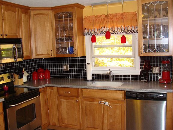 Kraft-Maid maple cabinetry and tile backsplash