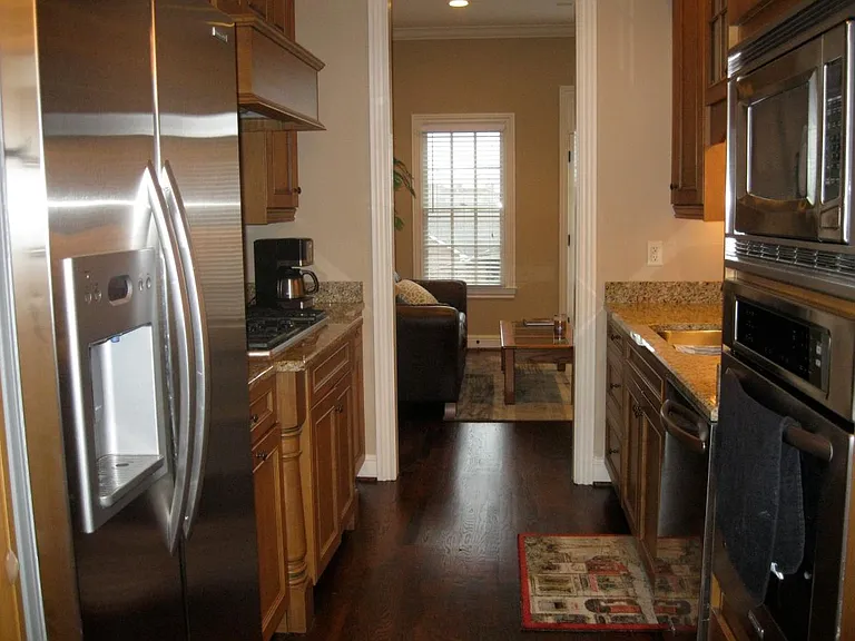 Galley kitchen with stainless steel applicances