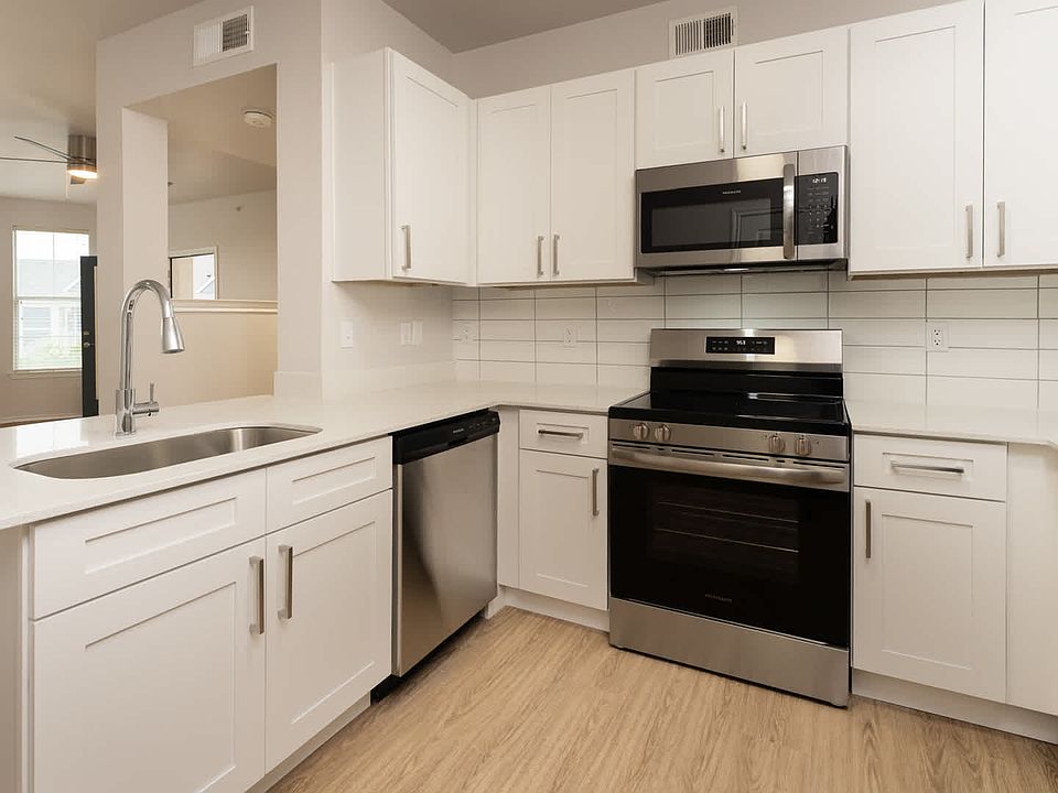 Kitchen with island and hard surface flooring