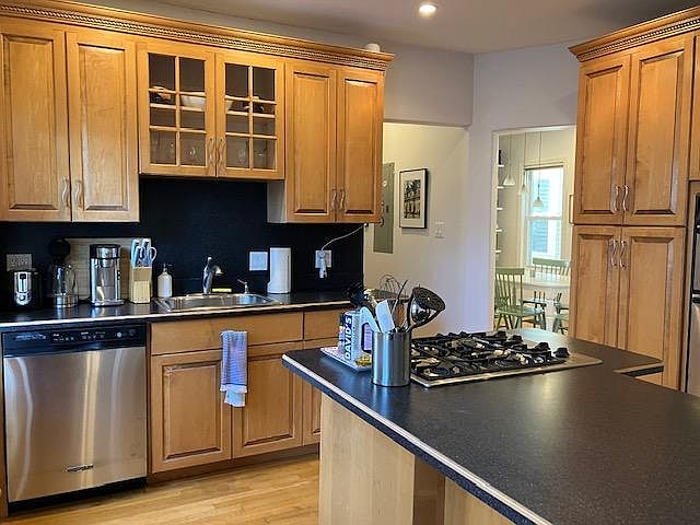 Eat-in kitchen with built-in seating at peninsula.
