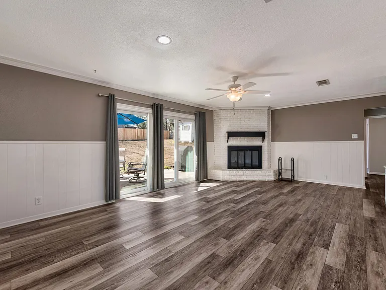 Living Room with Fireplace and Patio door to the backyard