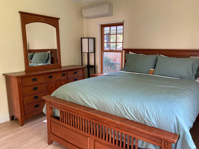 A queen bed and a matching bedroom set with 15 drawers to keep everything organized.
