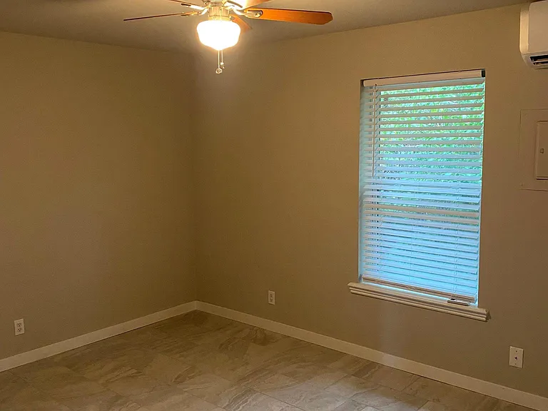 Bedroom-Walls and tile are grey.