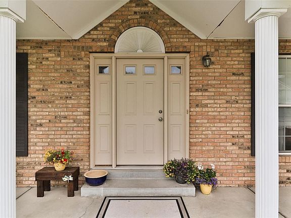 The large covered porch is very inviting with great curb appeal!
