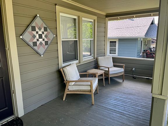 There is plenty of space on the front porch to extend your ourdoor living space.