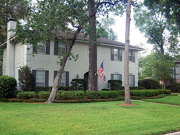 Set back on a large nicely landscaped lot.