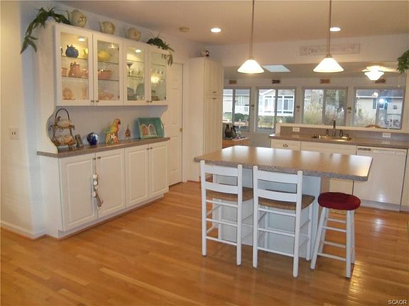 Kitchen with island open to sunroom