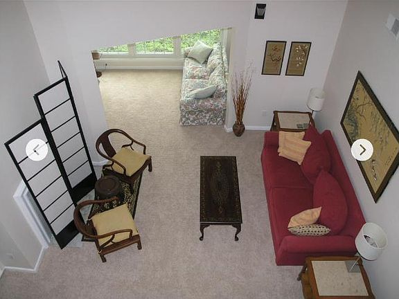 View from loft into living room and sunroom