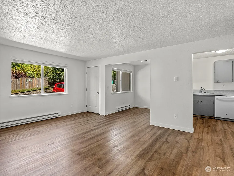 Apt 16 - Spacious Living Room with Gorgeous Wood Plank Flooring
