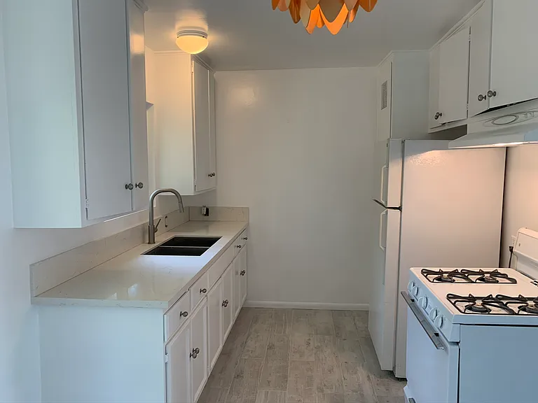 Kitchen with quartz countertops and stainless steel sink