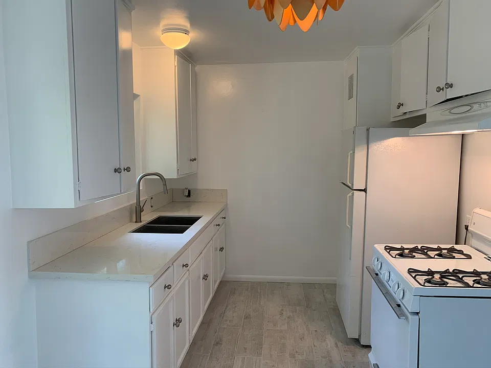 Kitchen with quartz countertops and stainless steel sink