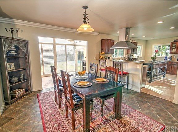 Formal dining area adjacent to the step down living room, step down family room, and newly remodeled kitchen.