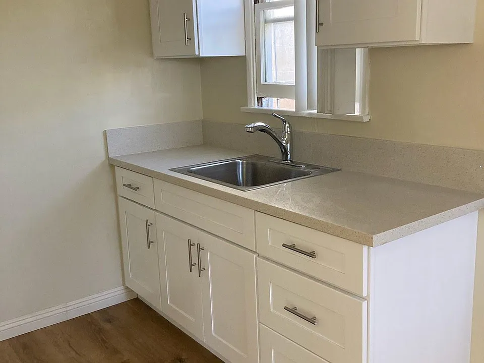 Remodel kitchen with new cabinets and sink