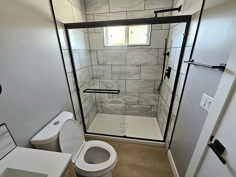 60 inche walk-in shower with rain spout.