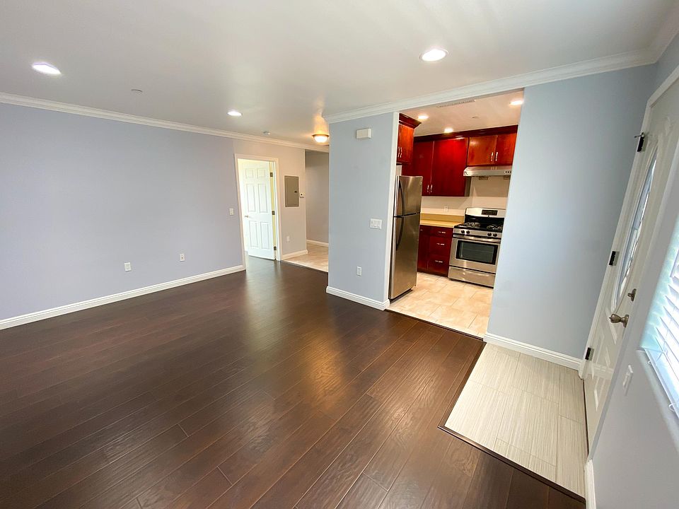 View of living room and kitchen.