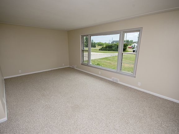 As you enter the home you walk right into the spacious living room (12x20) that has a large picture window feeding the area with tons of natural light and plenty of space for all of your furniture.