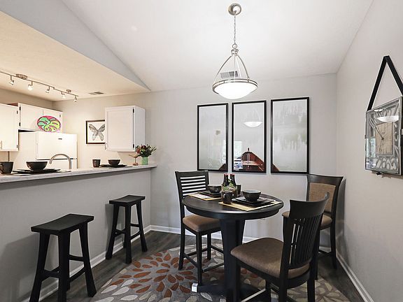 Bright dining area with open kitchen layoutperfect for everyday meals or entertaining guests.