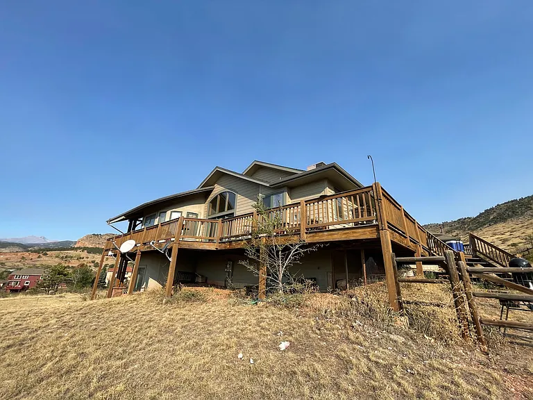 South side of home with wrap around deck.