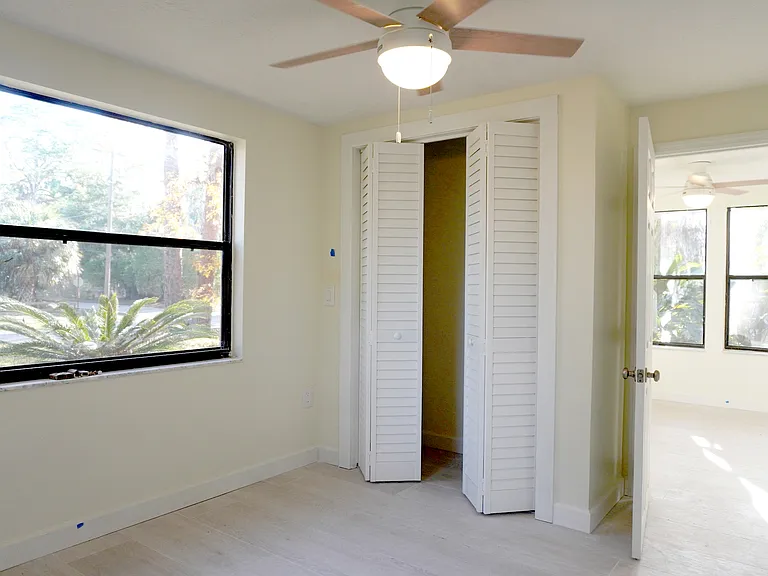 From the second bedroom you can easily slip out to the sunroom for early morning and late evening relaxing.