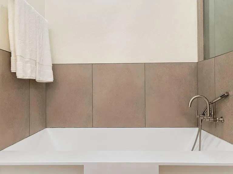 Large soaking tub in primary bedroom ensuite bathroom
