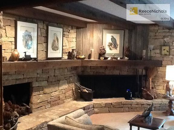 one of three dry-stack limestone fireplaces