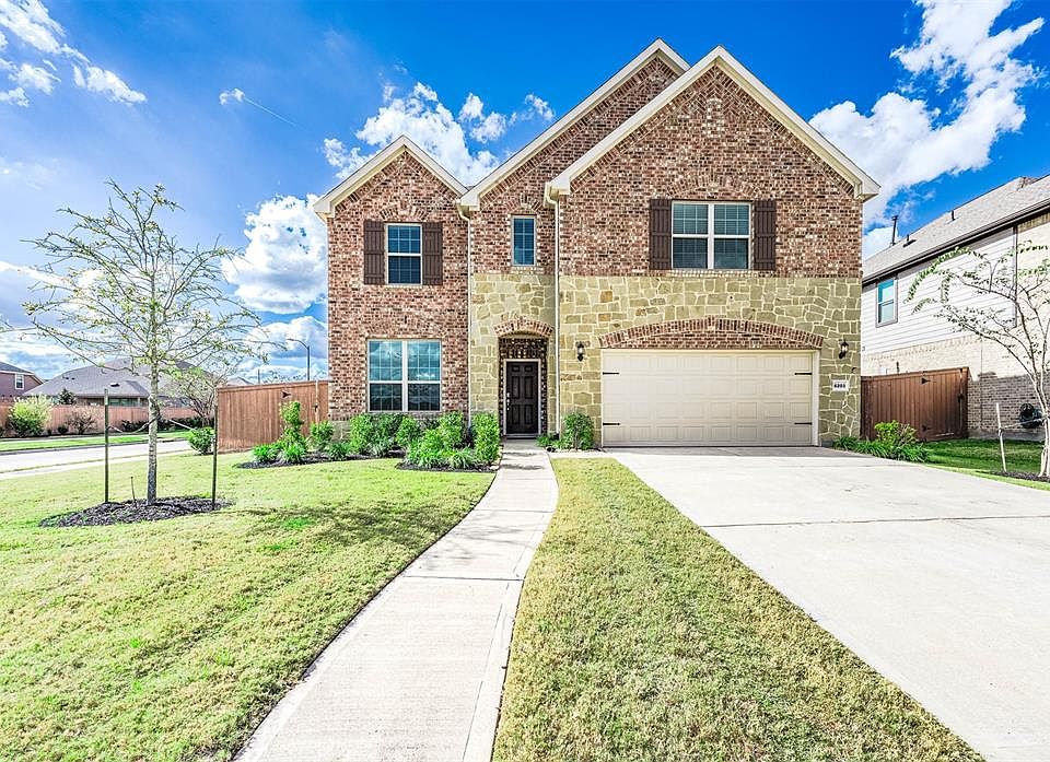 Welcome home to 6203 Rosehill Harvest Loop!