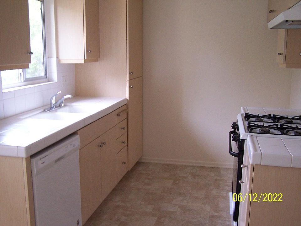 Kitchen with gas stove and dishwasher