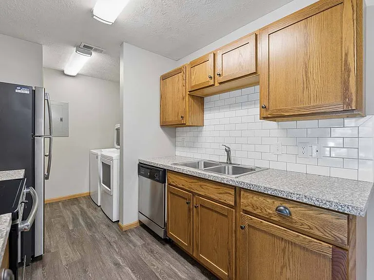 A thoughtfully designed kitchen with updated finishes and ample storage makes every meal feel effortless and inviting.