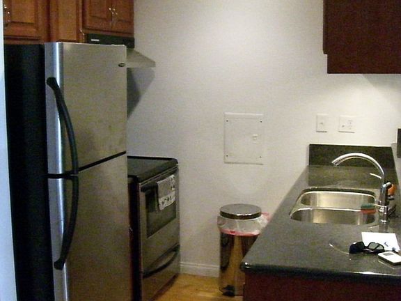 New kitchen w/ stainless appliances, cherrywood cabinets & granite counters