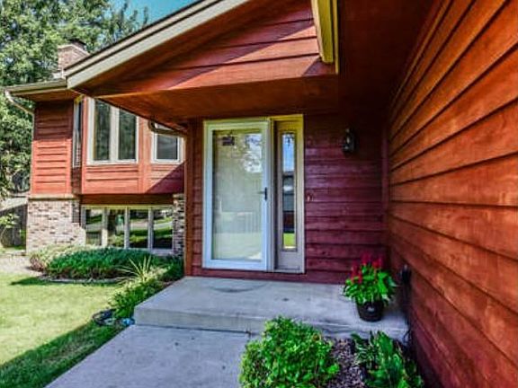 Cedar siding and fresh landscaping welcome friends, family and guests.